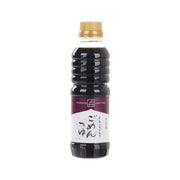 Dark soy-based soup base in plastic bottle with gold cap, front label visible
