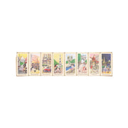 Assorted dark chocolate bars with Paris-themed wrappers in a single row