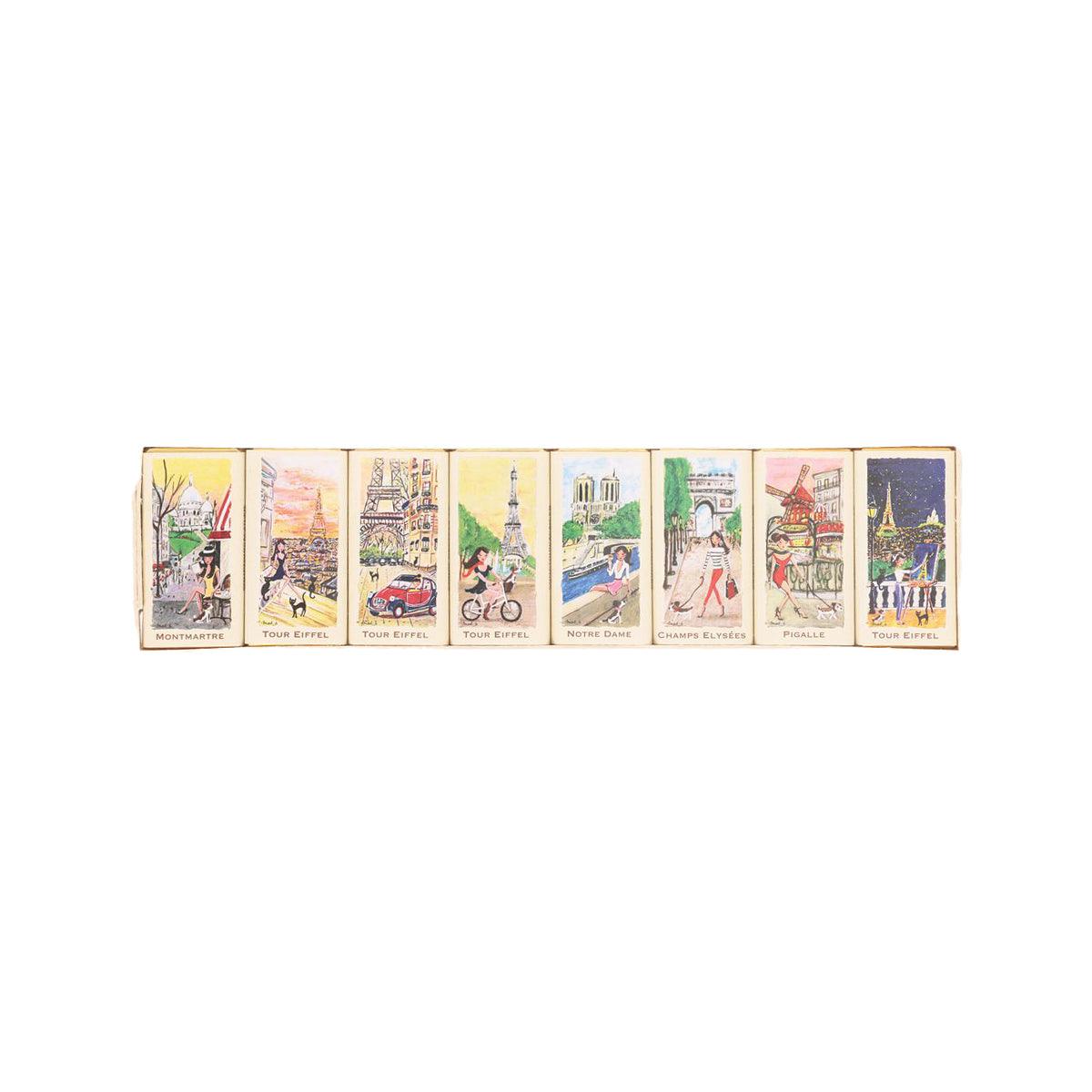Assorted dark chocolate bars with Paris-themed wrappers in a single row