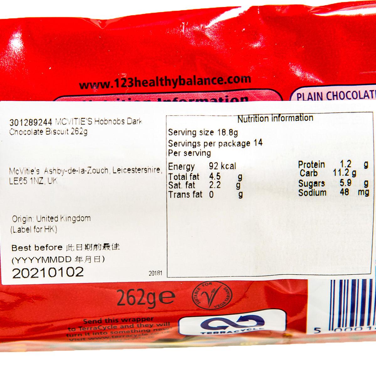 Dark chocolate biscuit nutrition label close-up on red wrapper