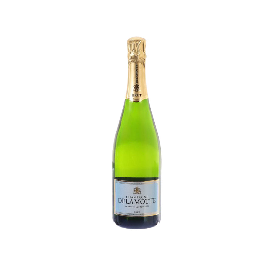 DELAMOTTE Brut champagne bottle with gold foil and green glass, front label visible