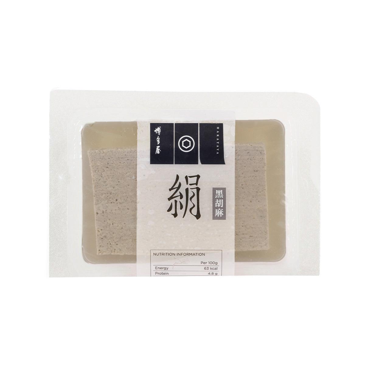 Packaged black sesame soft tofu in clear wrap, rectangular blocks