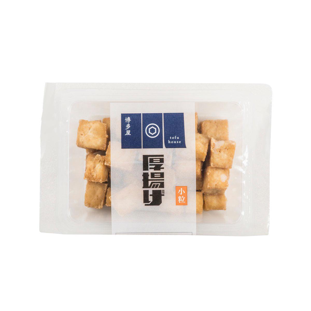 Deep fried tofu cubes in sealed clear plastic tray with brand label