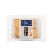 Packaged deep-fried tofu cubes, golden-brown, 4 pieces