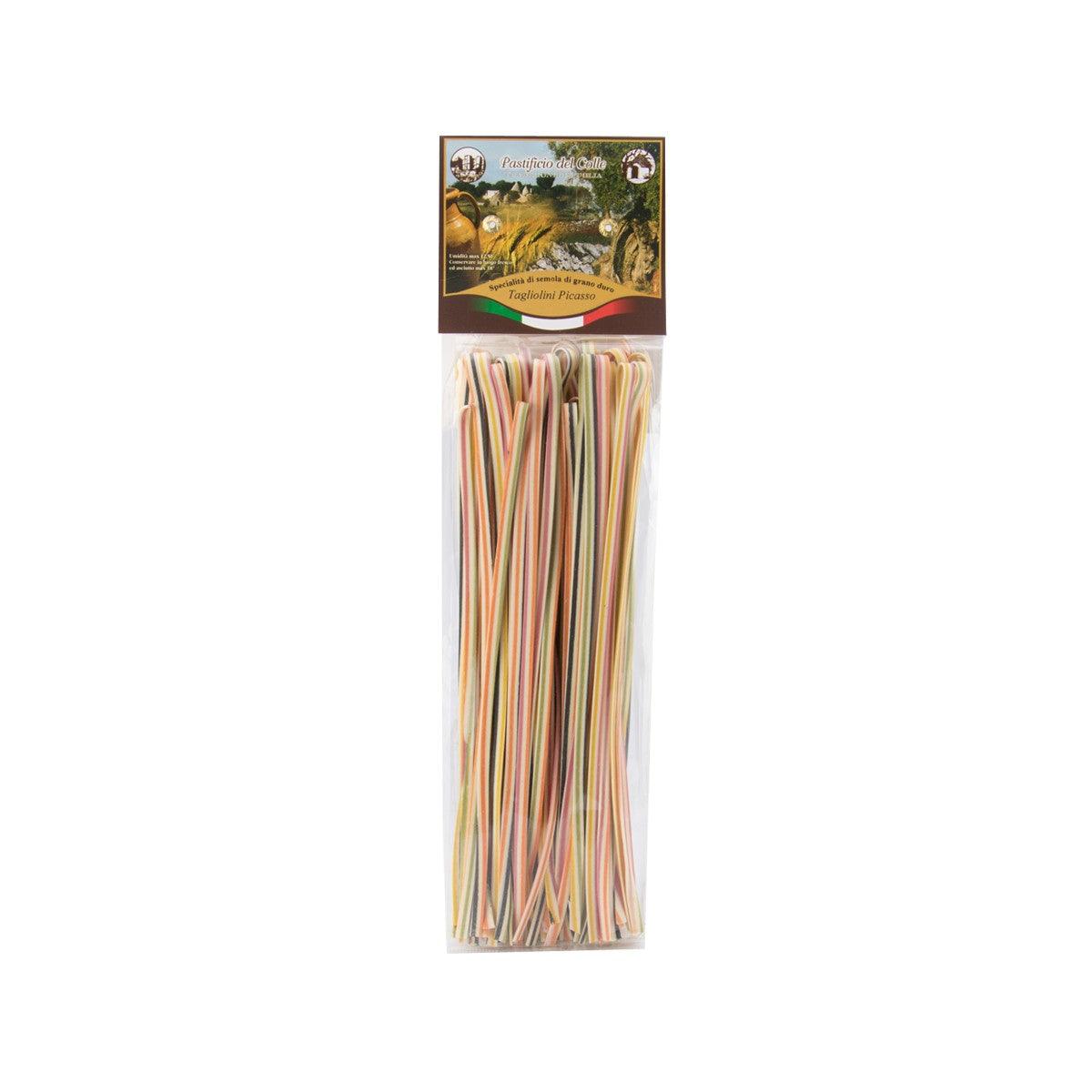 Colorful tagliolini pasta in sealed 250g package, multicolor thin strands visible