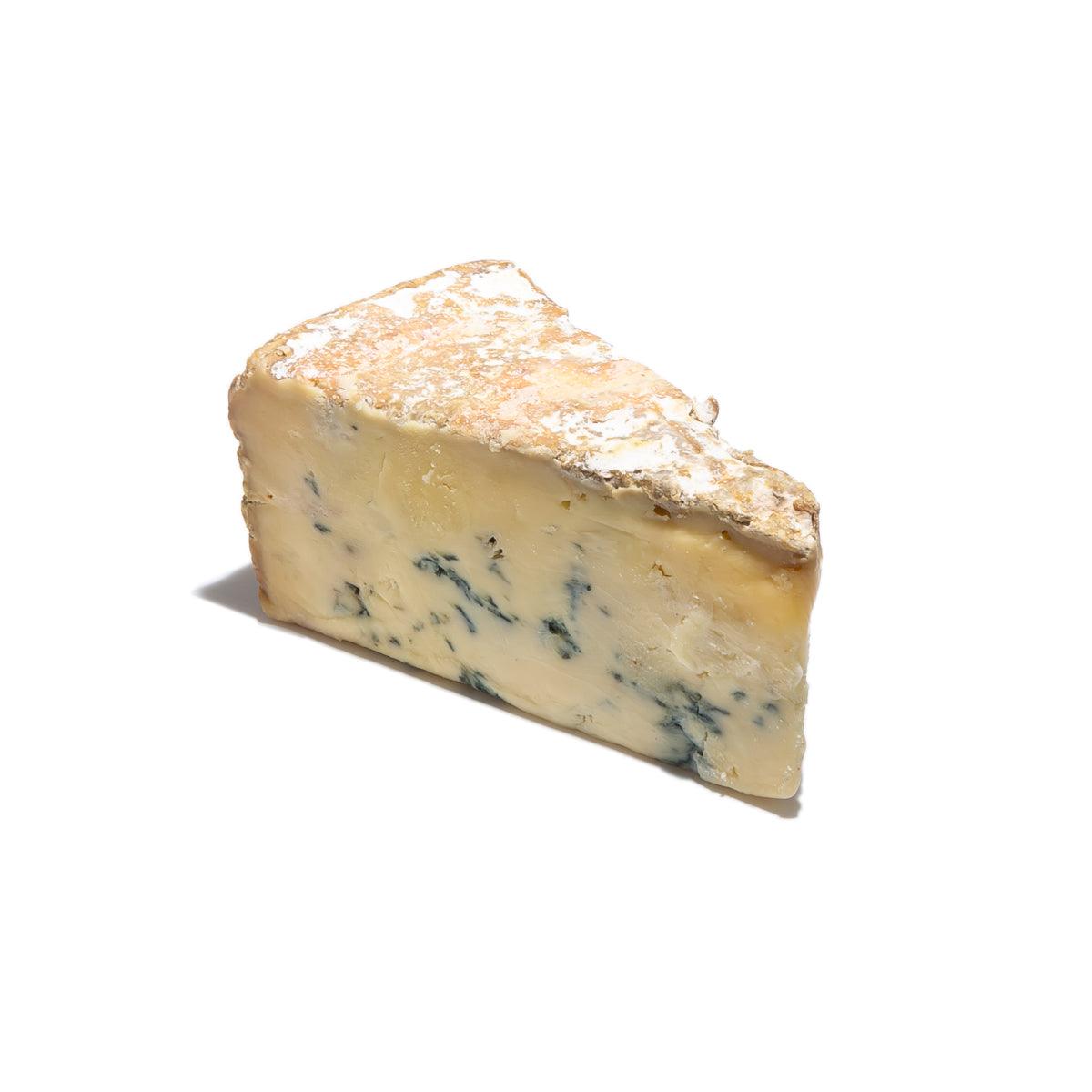 Stilton cheese wedge with creamy pale-yellow interior and blue veining