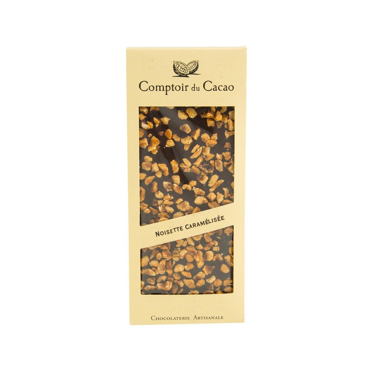 Chocolate bar with dark chocolate and caramelized hazelnut pieces, front package