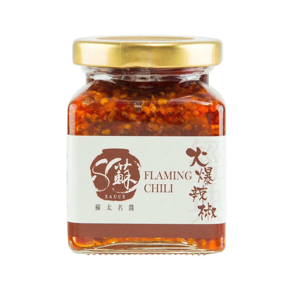Chili sauce jar with amber red chili flakes and gold lid