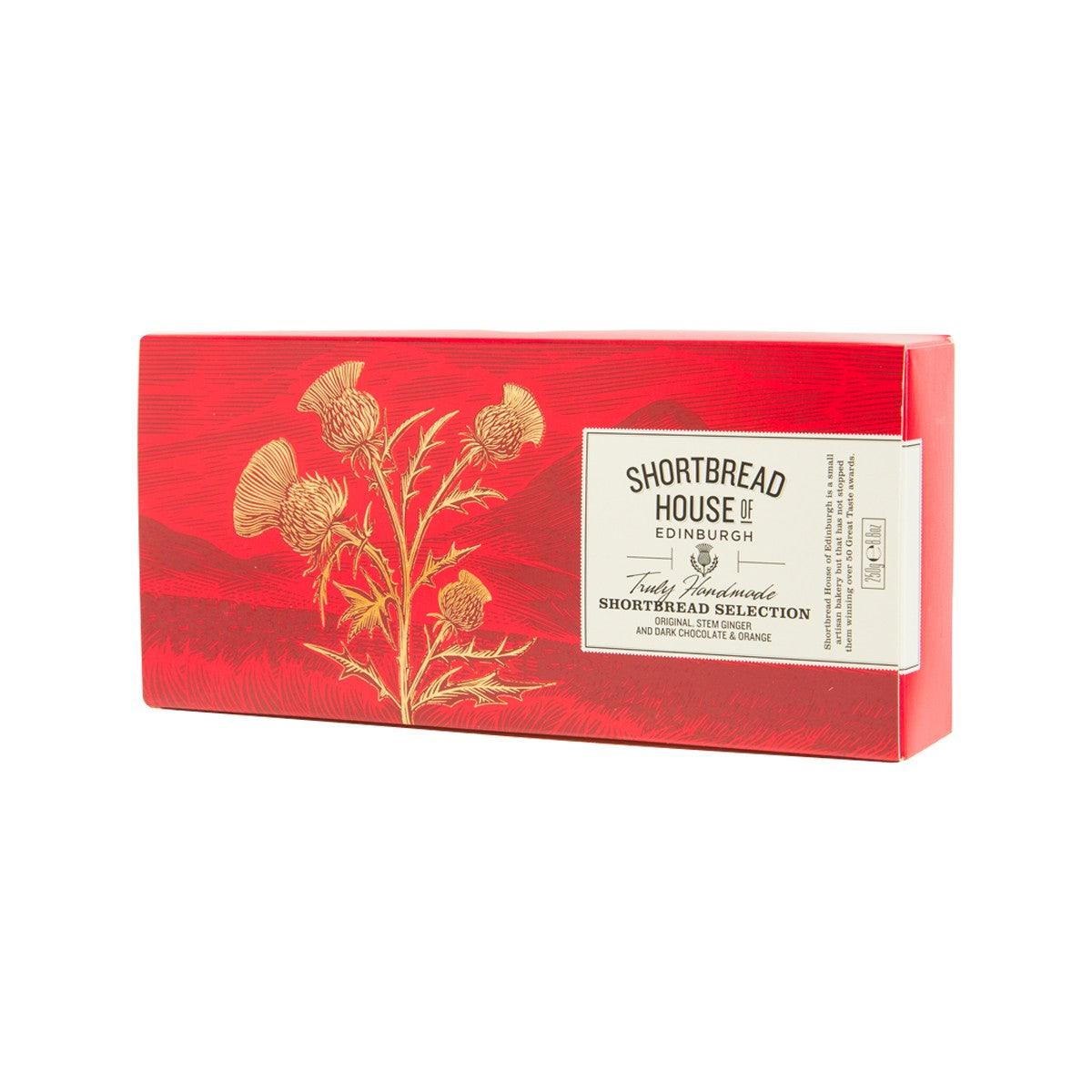 Red shortbread selection box with floral design and brand label