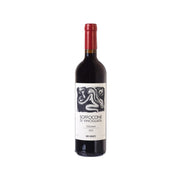 Wine bottle with red foil cap and front label, dark glass.