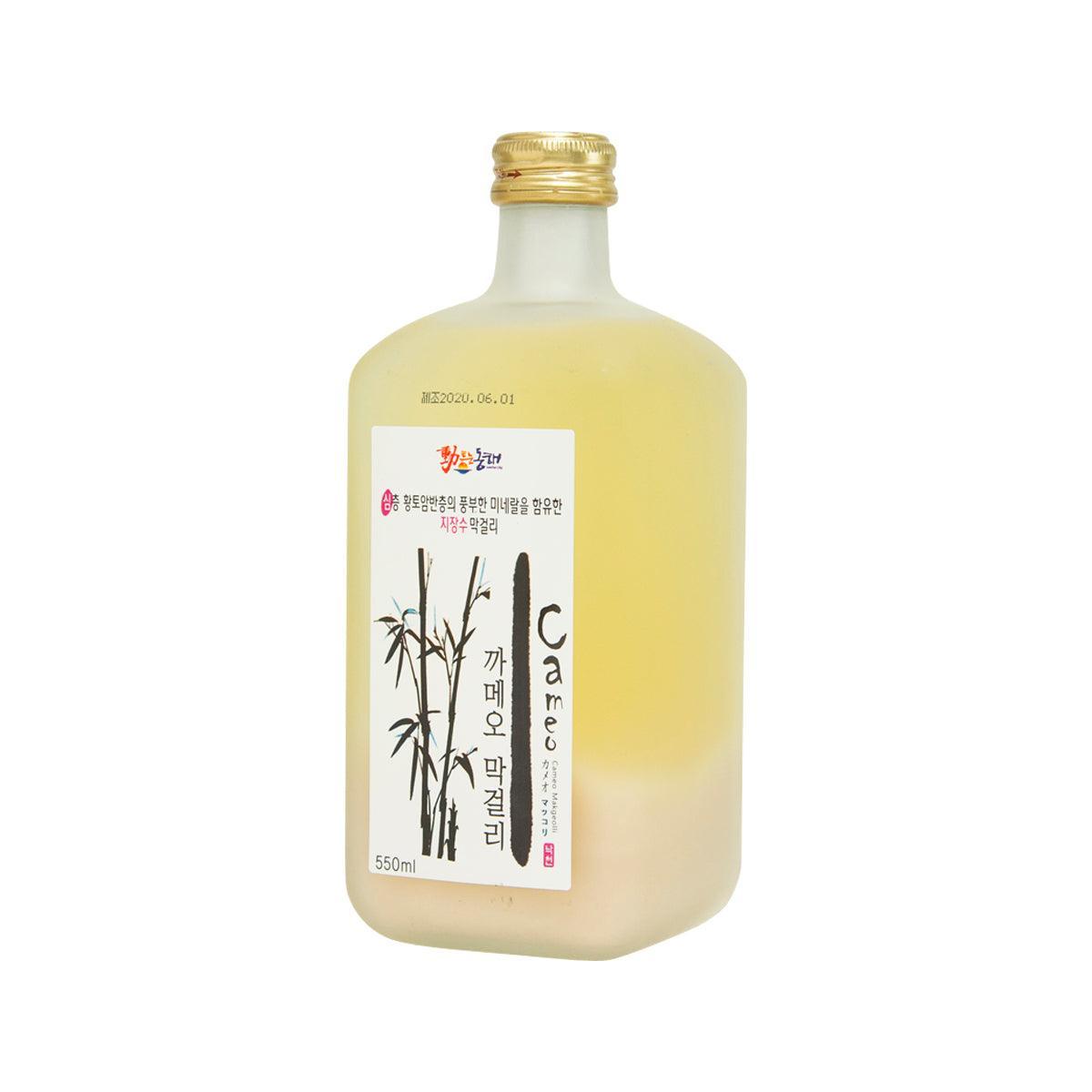 NAKCHEON makgeolli bottle, pale yellow, gold cap, front label, angled view