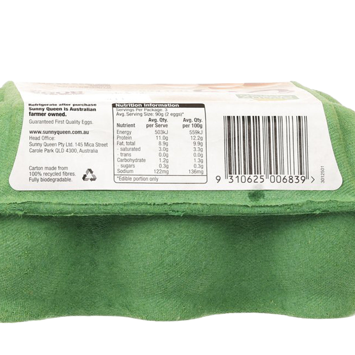 Close-up of organic free range egg carton nutrition panel and barcode on green tray