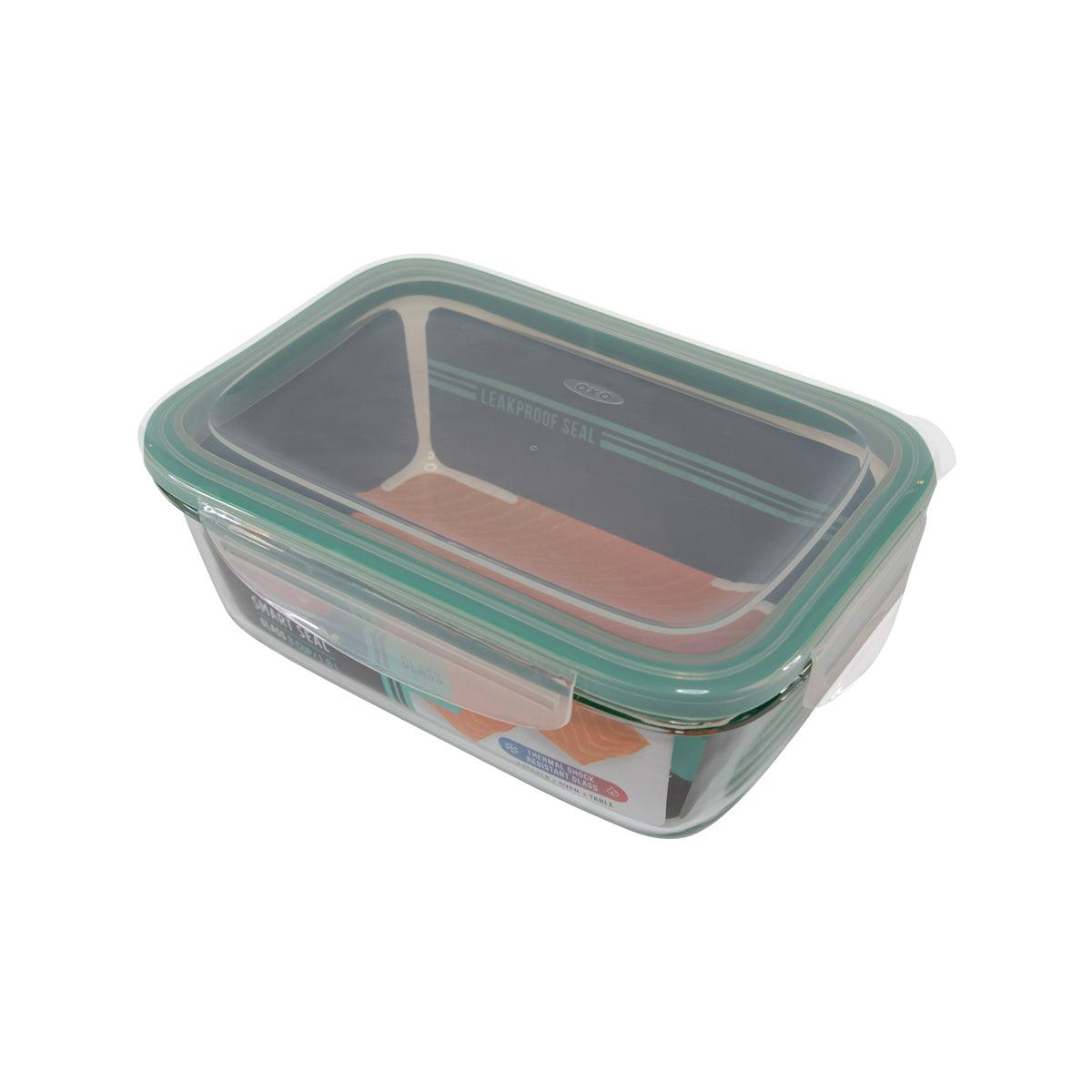 Rectangular glass food storage container with teal snap-on lid, clear body