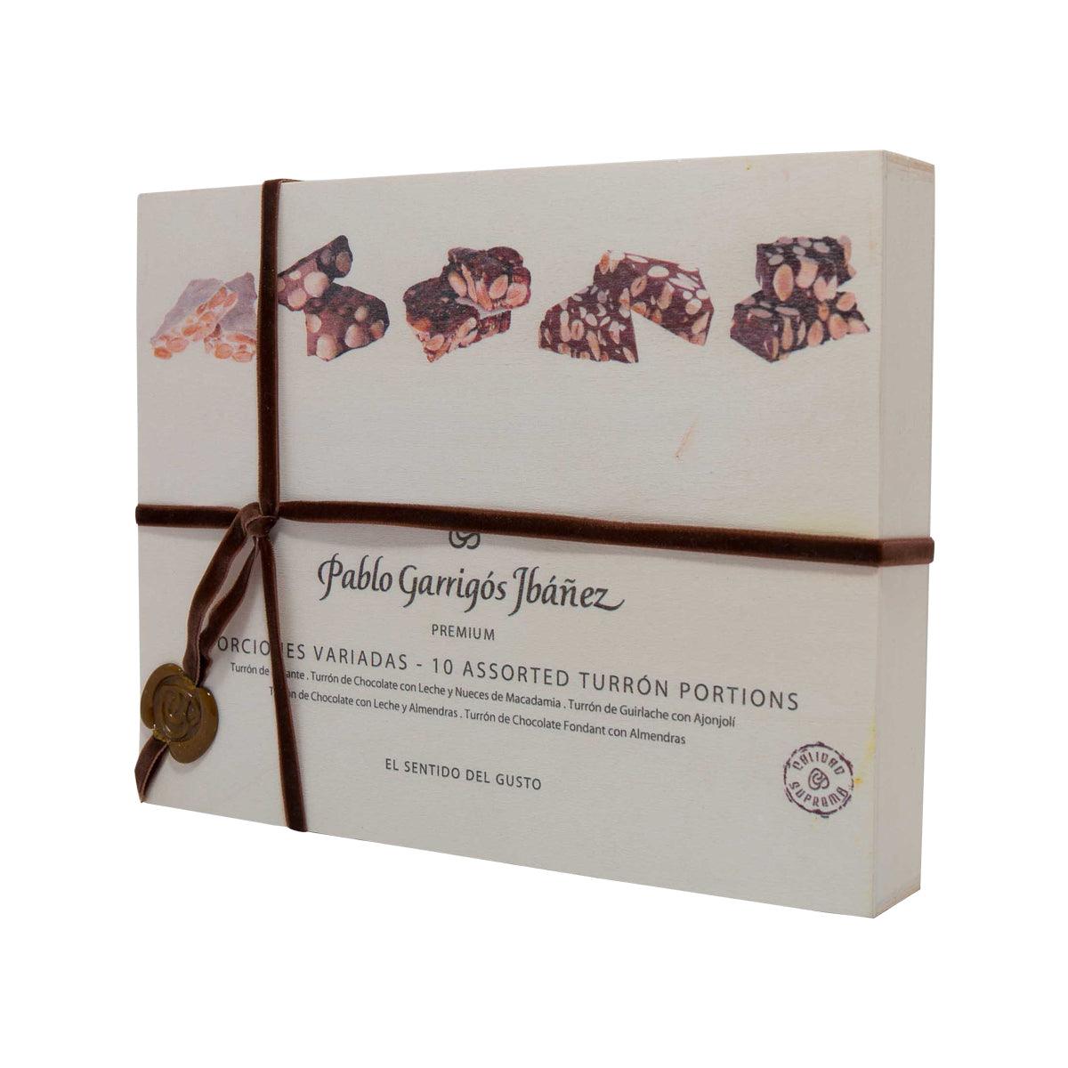 Assorted turron portions gift box, ribbon tied, printed chocolate pieces on lid
