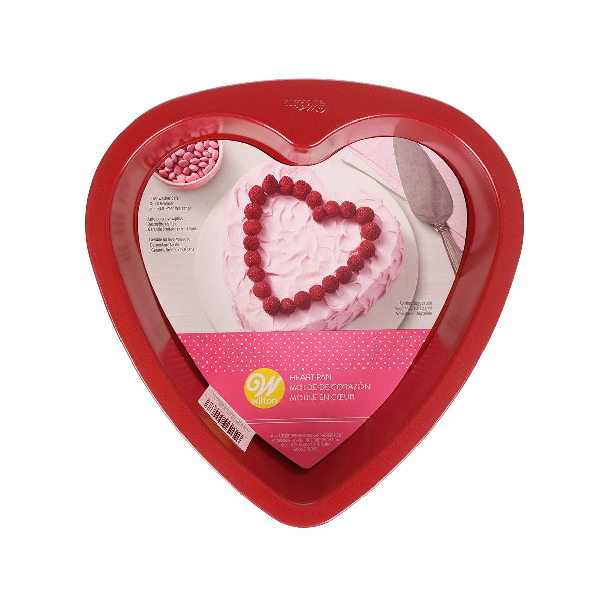 Red heart-shaped nonstick baking pan, 9 in, shown in retail packaging