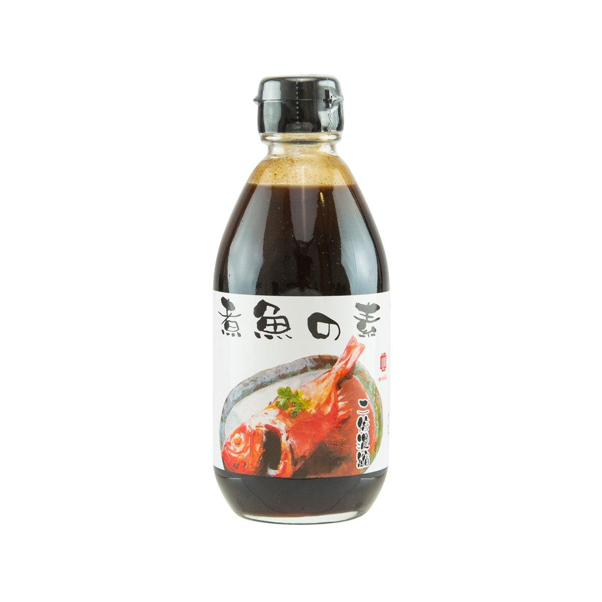 Fish soy sauce bottle with silver cap; dark brown bottle with front label and red fish.