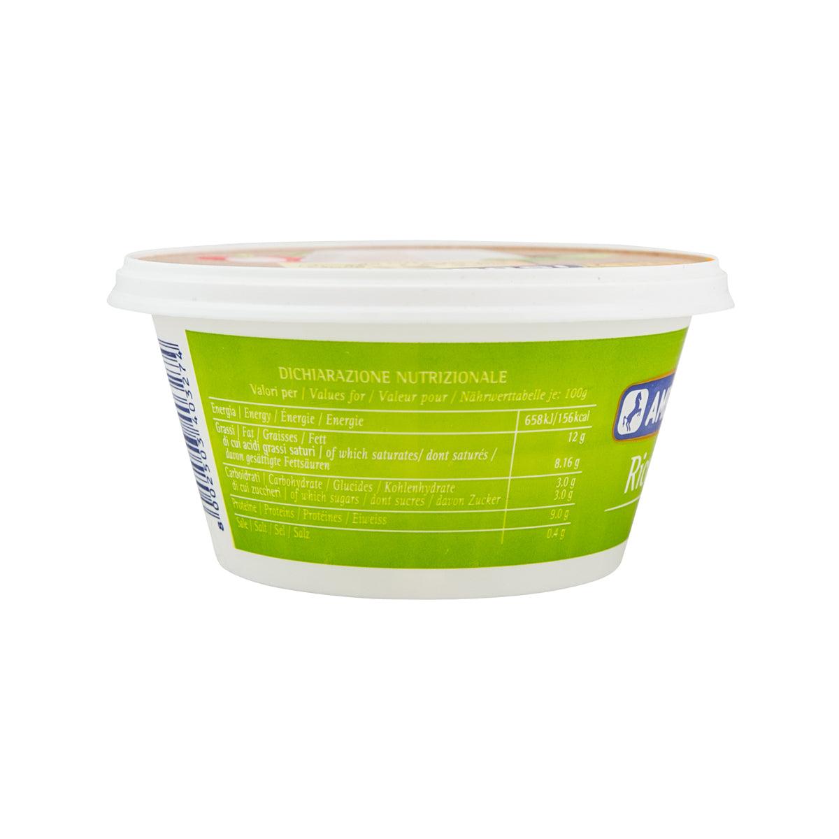 Ricotta cheese tub side with white lid rim and green nutrition information panel