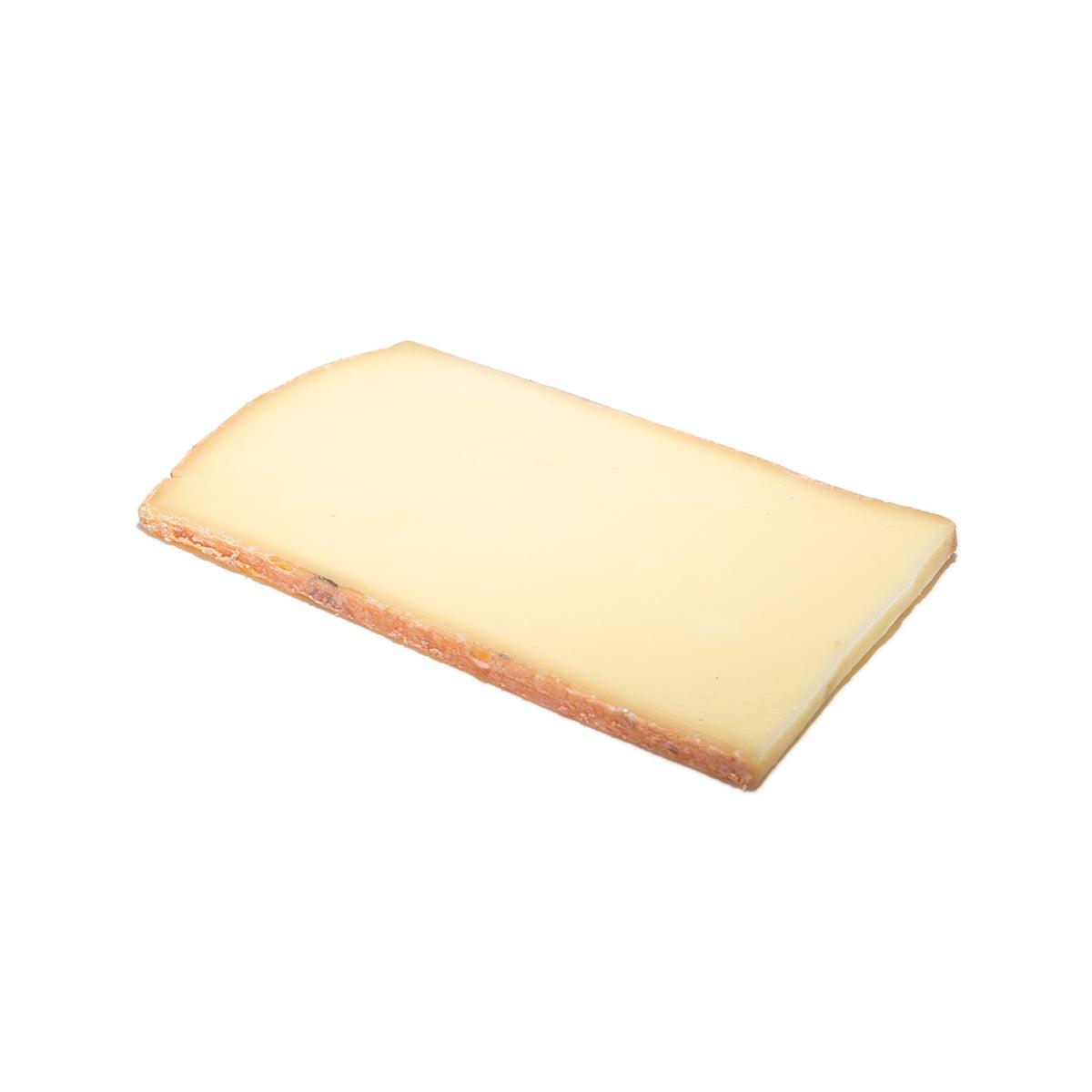 Appenzeller Classic cheese wedge, pale yellow with rind edge