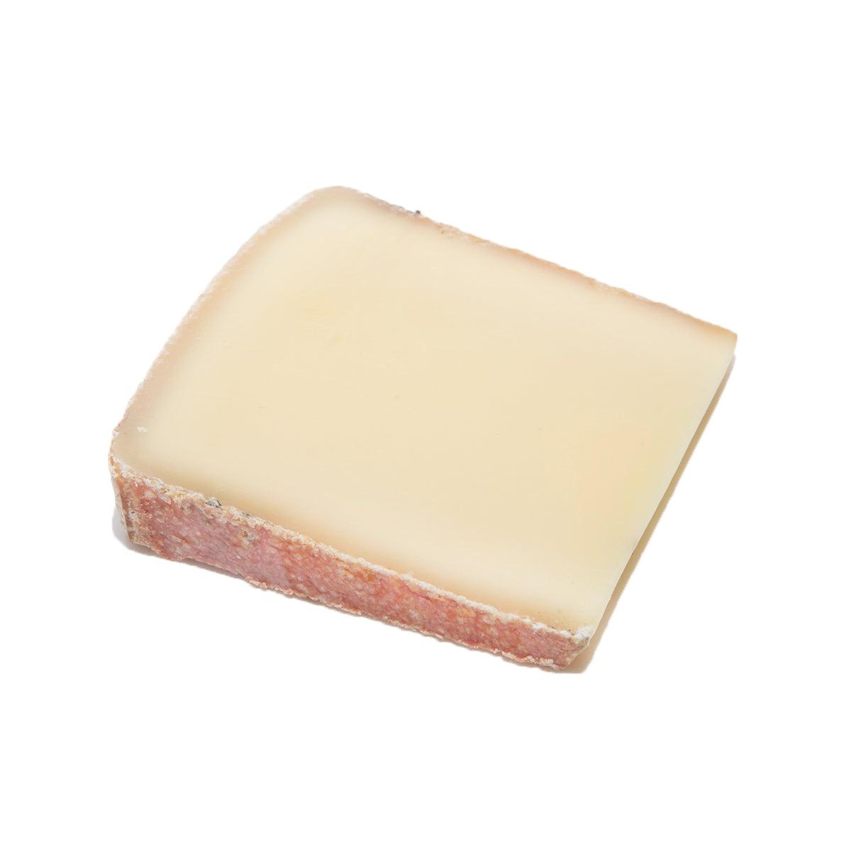 Appenzeller Extra cheese wedge, pale yellow with reddish rind