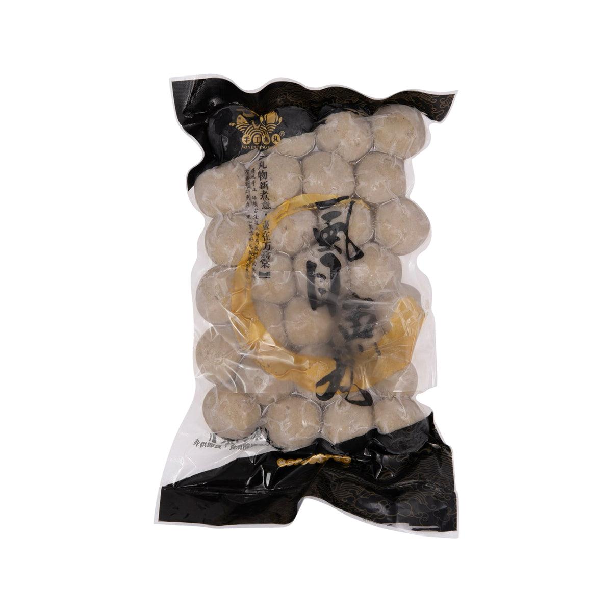 Milk fish ball bag with round gray-beige fish balls in sealed clear packaging