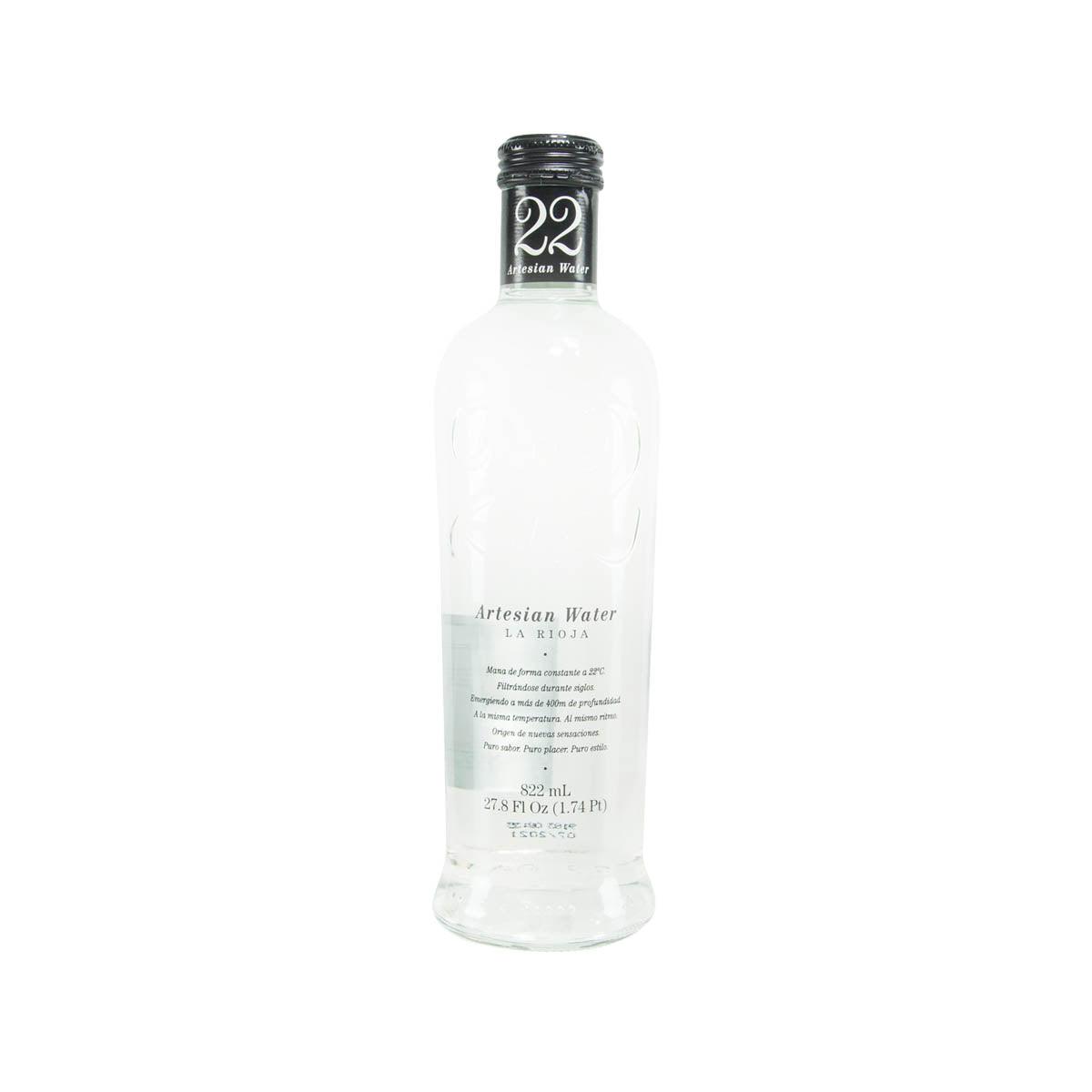 Natural mineral water bottle, clear glass with dark cap, 822 mL front label