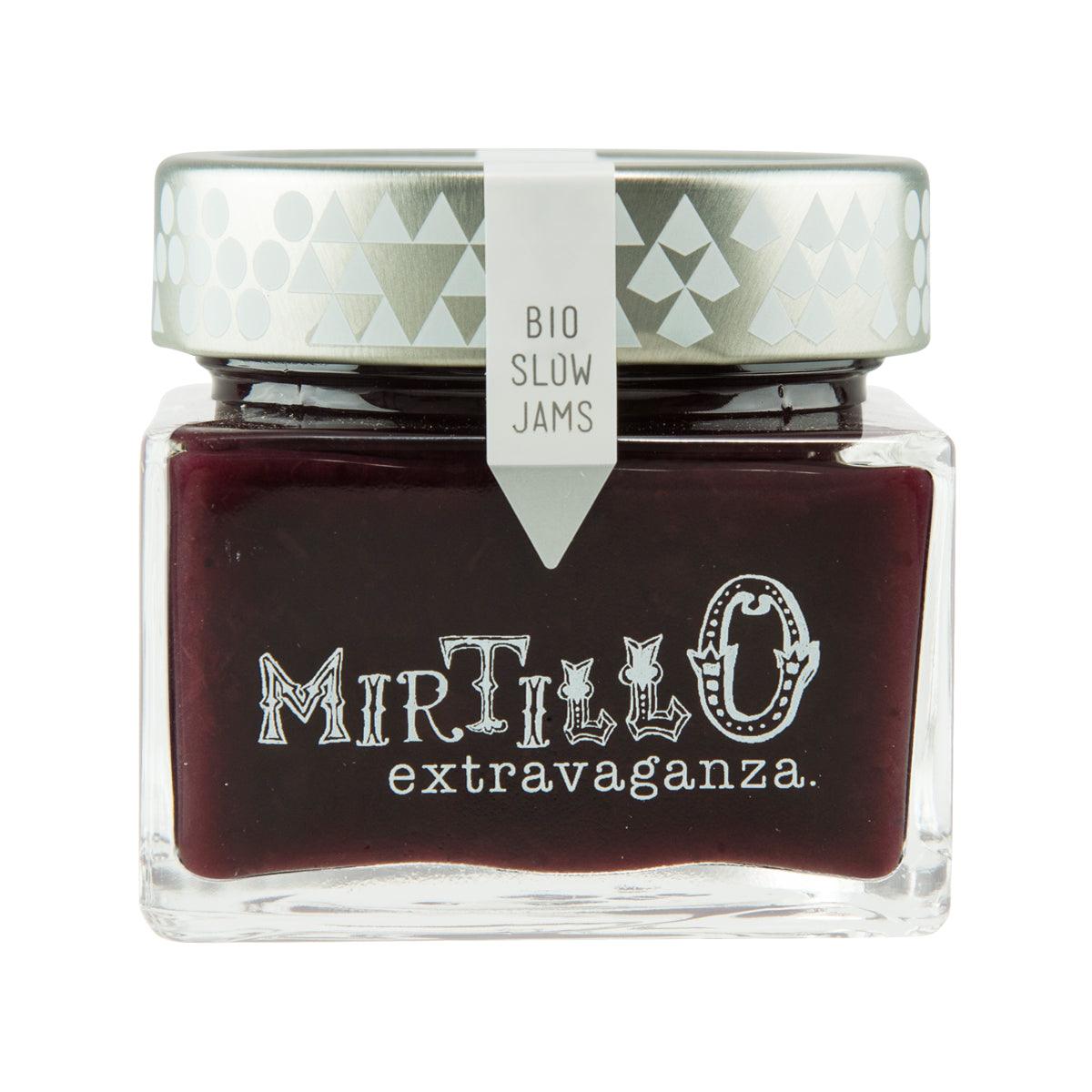 Organic blueberry jam jar with dark berry filling, white cap, printed label