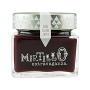 Organic blueberry jam jar with dark berry filling, white cap, printed label