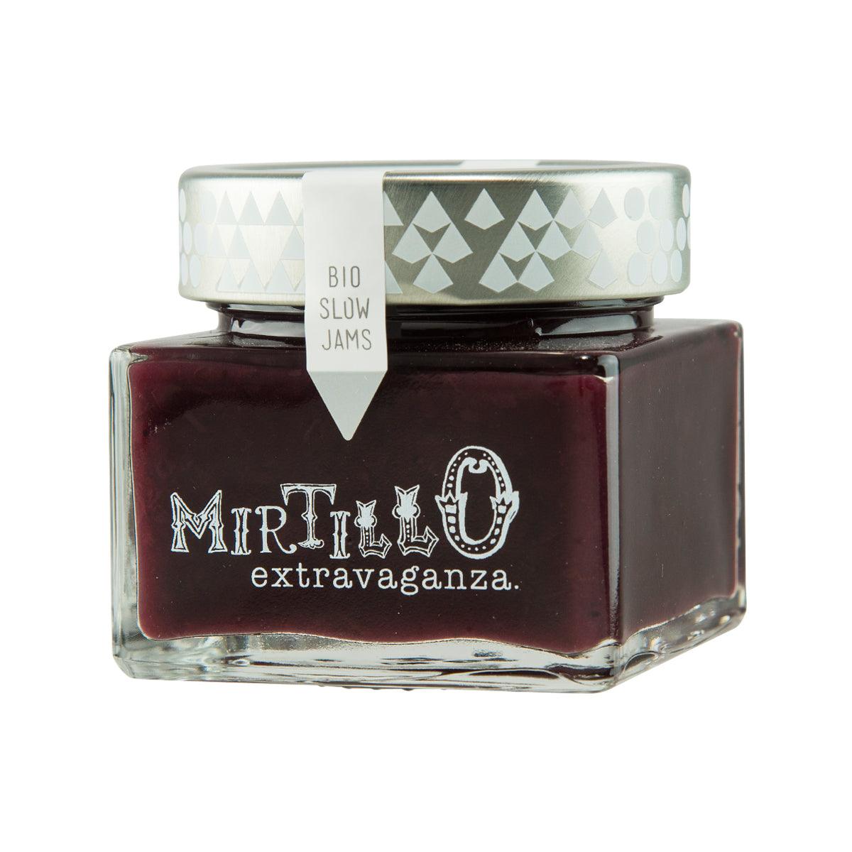 Dark berry jam jar with white cap and printed label, front view
