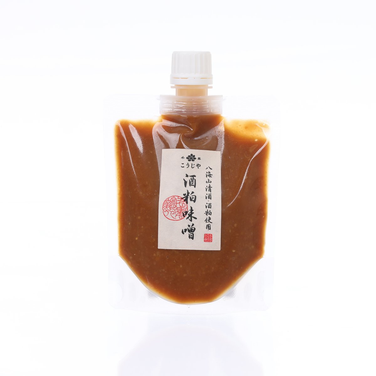 Miso with sake lees pouch (200g), amber liquid, front label