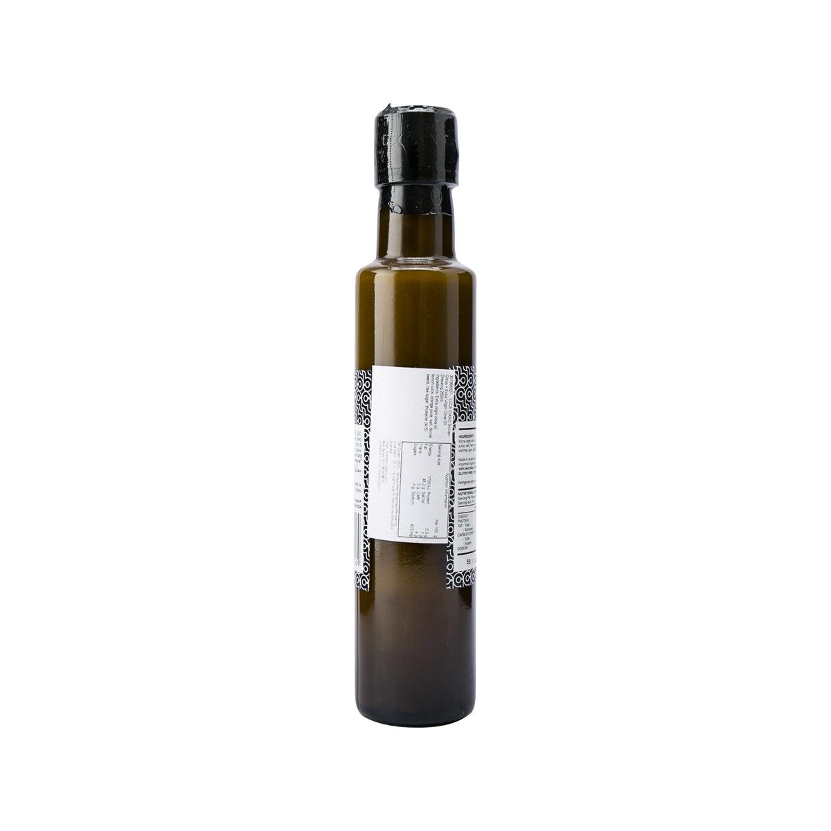 Citrus EVOO dressing bottle with black cap and barcode label on back