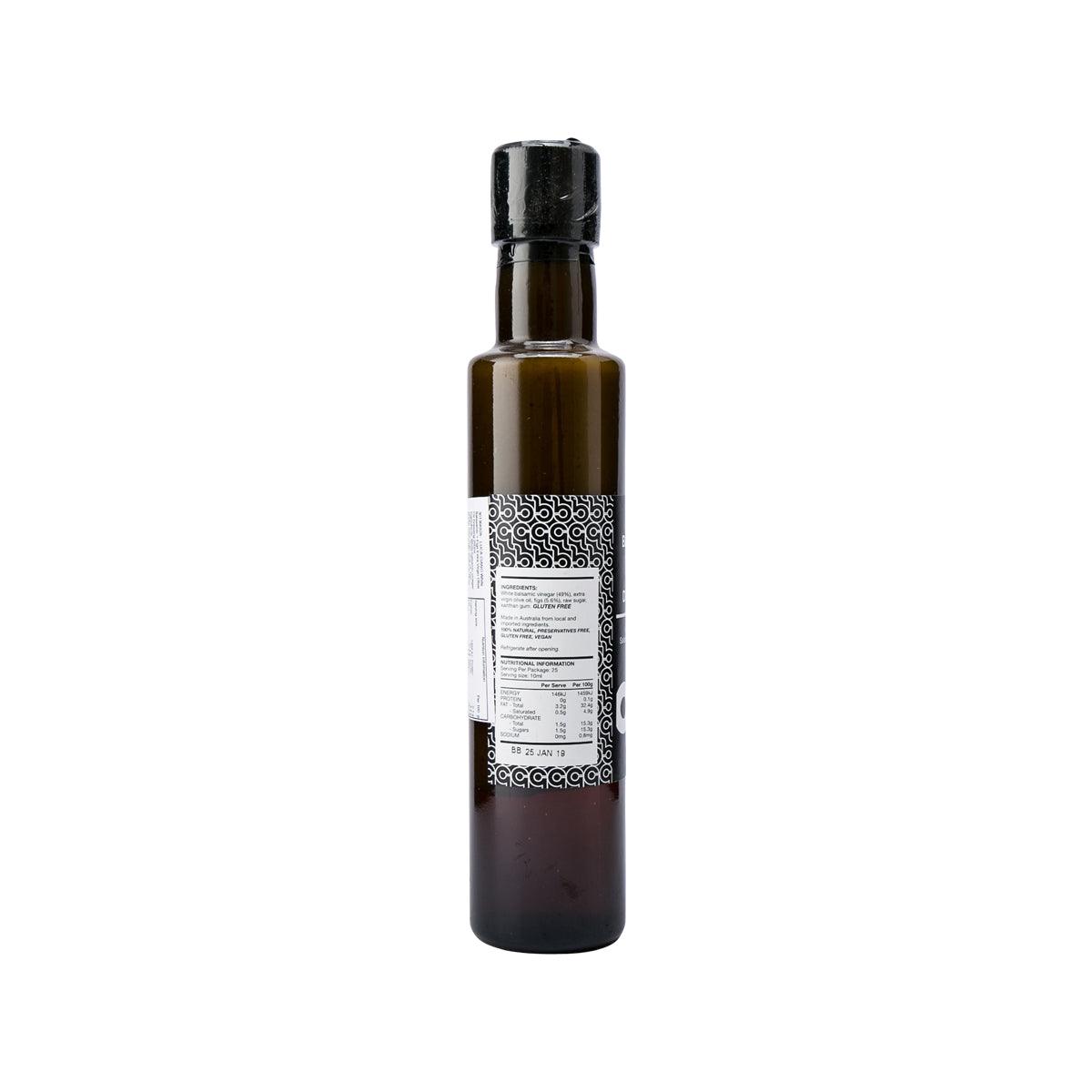 LUCA CIANO dressing bottle with black cap, label panel with decorative borders