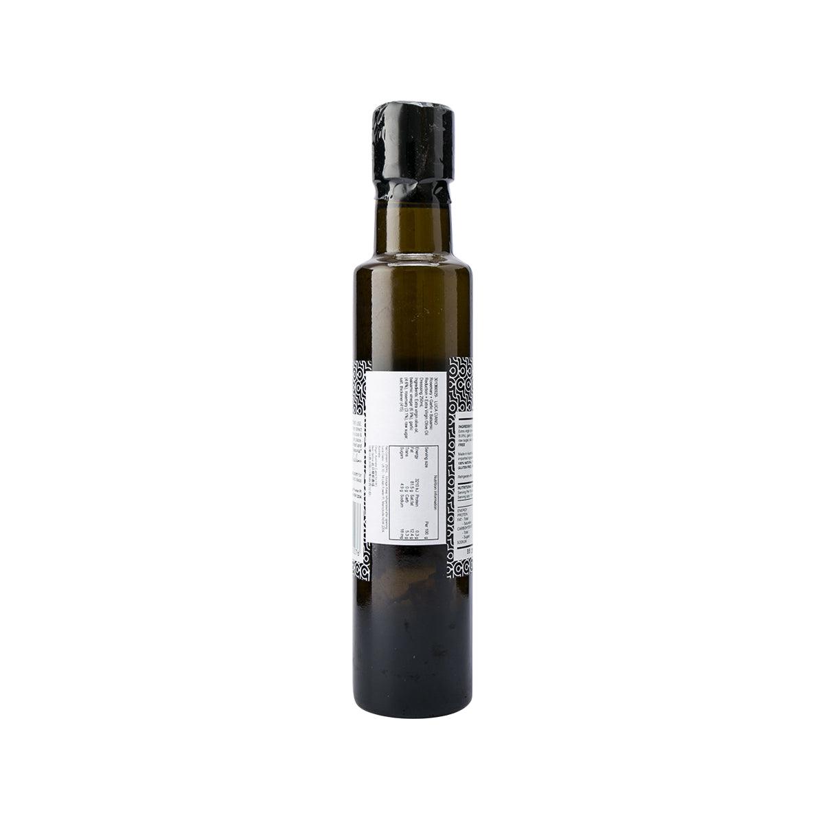 Balsamic dressing bottle with barcode label, dark glass and black cap