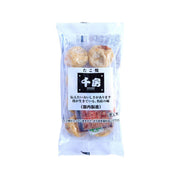 Frozen takoyaki snack in clear bag, with two round pieces and sauce pack