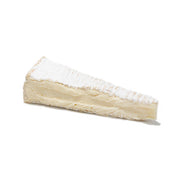 Brie de Meaux AOP cheese wedge with white rind, pale creamy interior