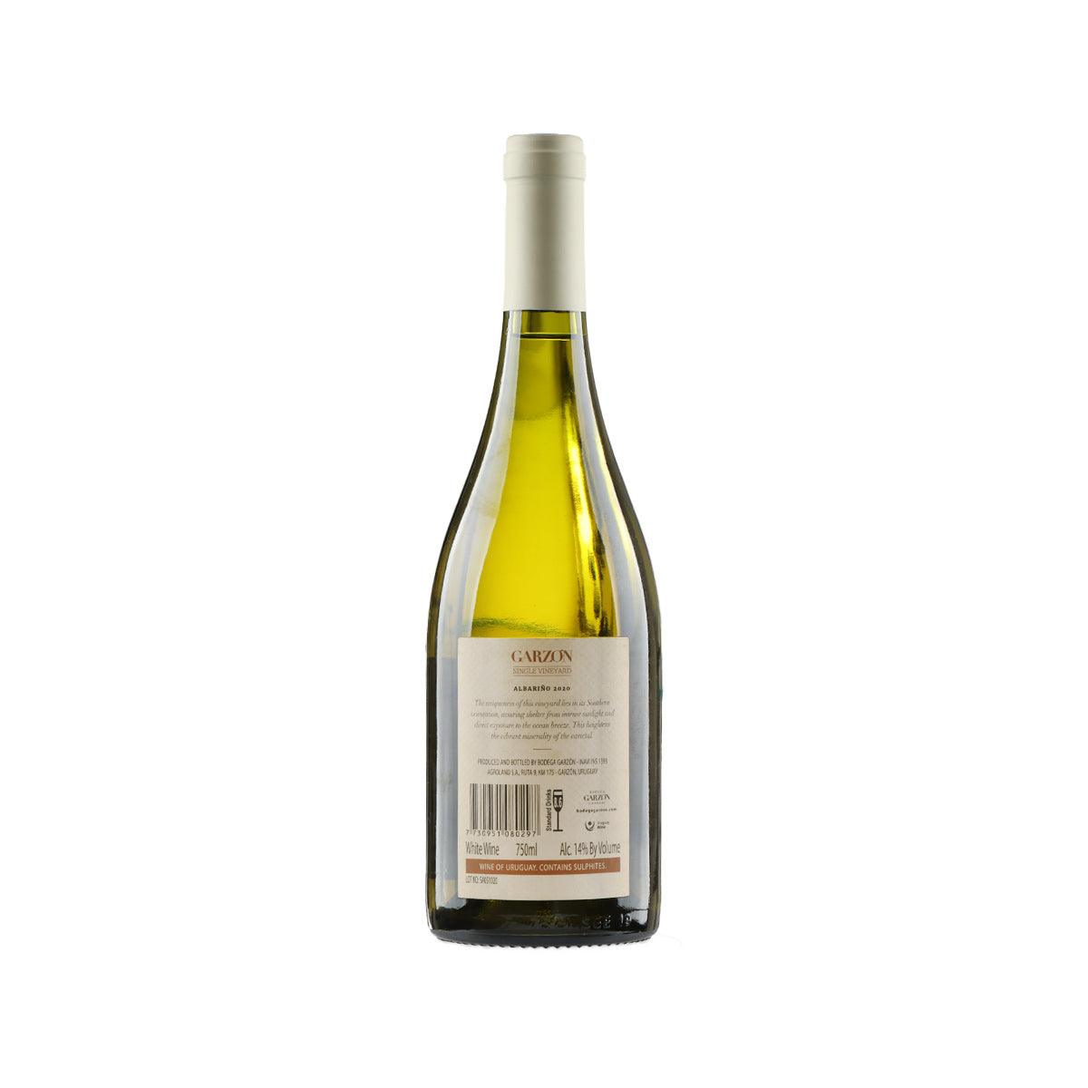 White wine bottle with GARZON back label and barcode, cork top, green glass