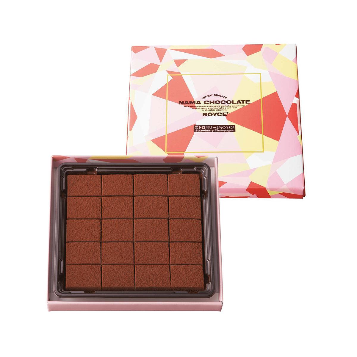 Open box of dark brown nama chocolate squares with matching decorative cover