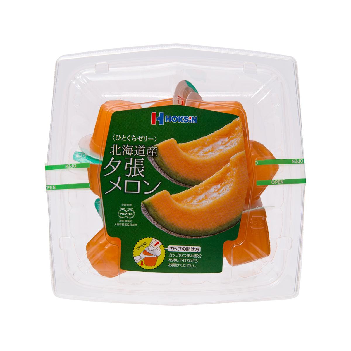 HOKUSHIN one-bite melon jelly in clear plastic tray, orange pieces with green front label