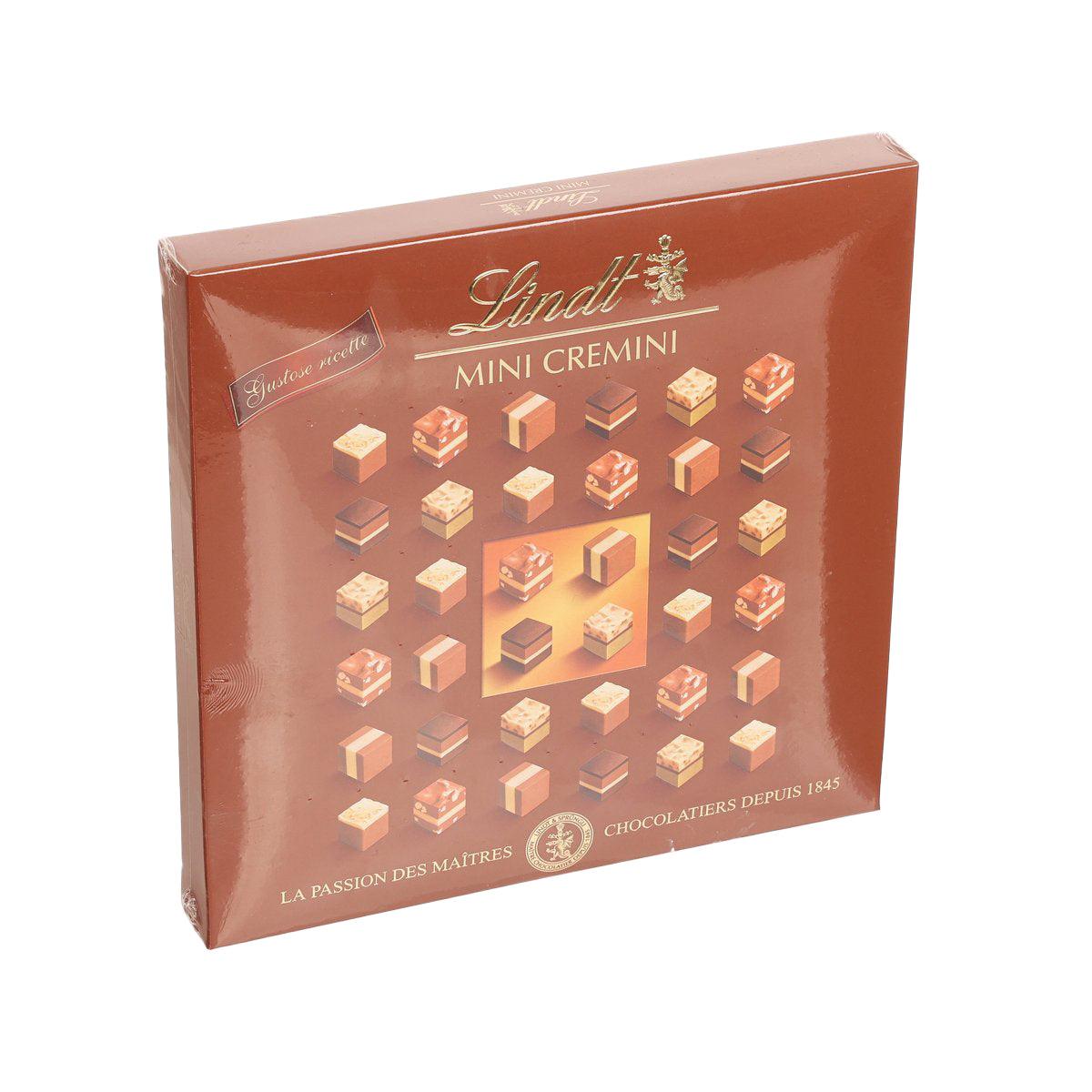 Chocolate assortment box with mini LINDT Cremini nougat pieces, angled front view