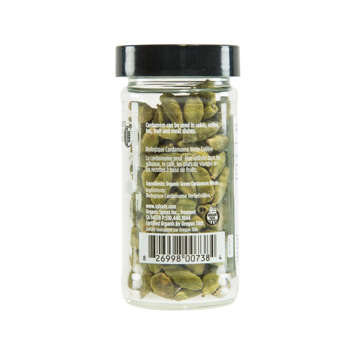 Organic green cardamom pods in glass jar, back label view, black lid