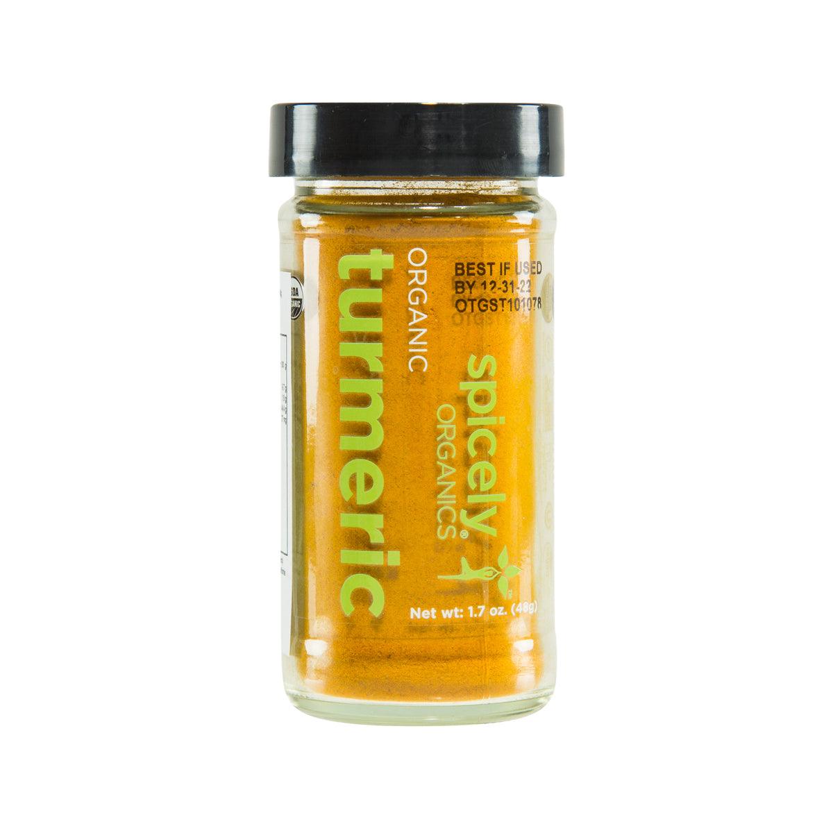 SPICELY organic turmeric seasoning jar, clear glass with black lid, yellow powder