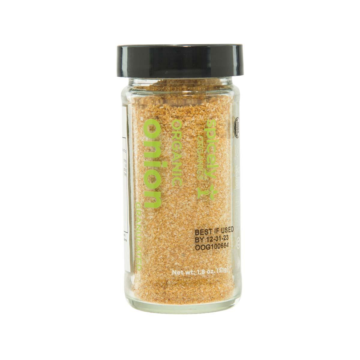 SPICELY organic onion granules in clear glass jar with black lid