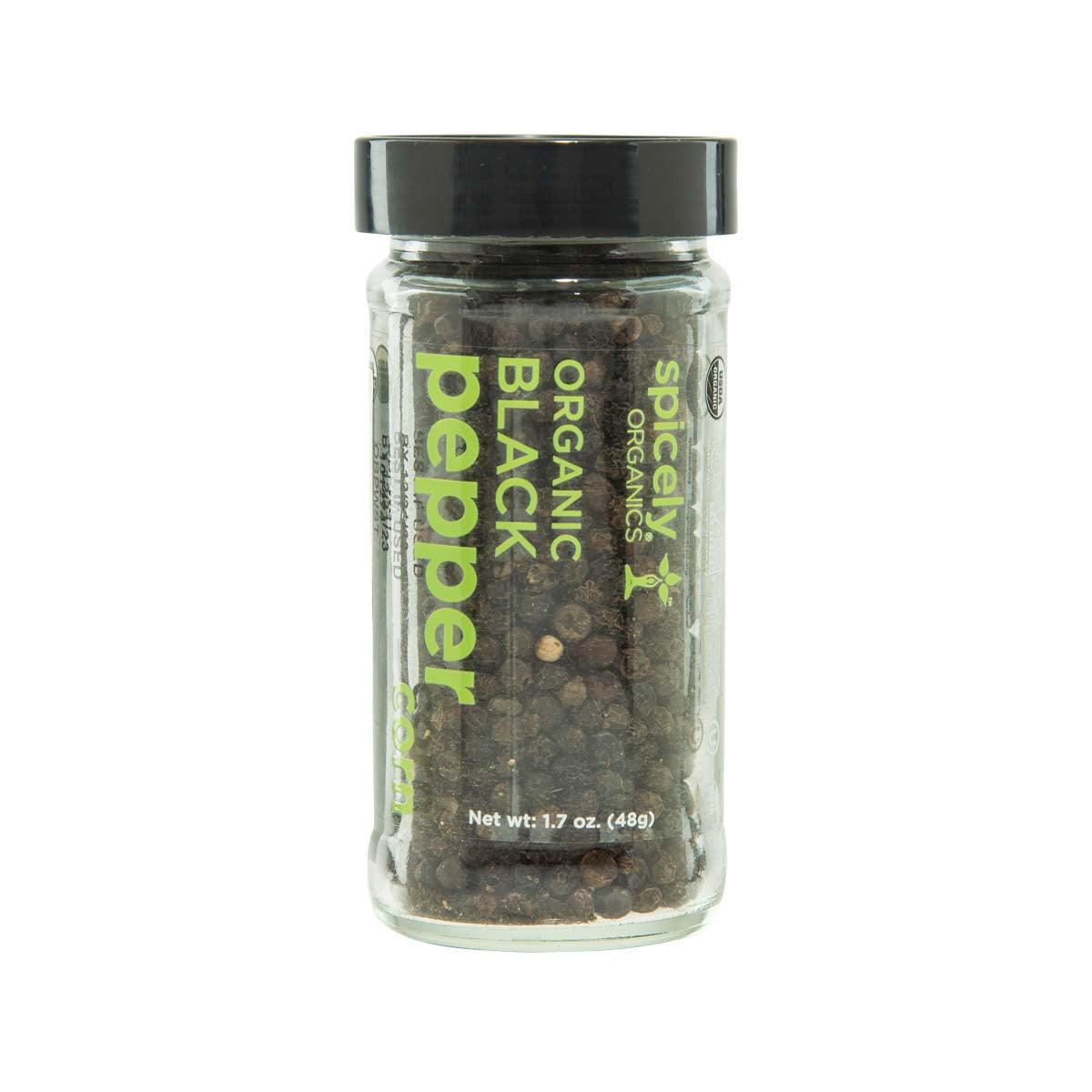 SPICELY organic black peppercorns jar, clear glass with black lid and peppercorns inside.