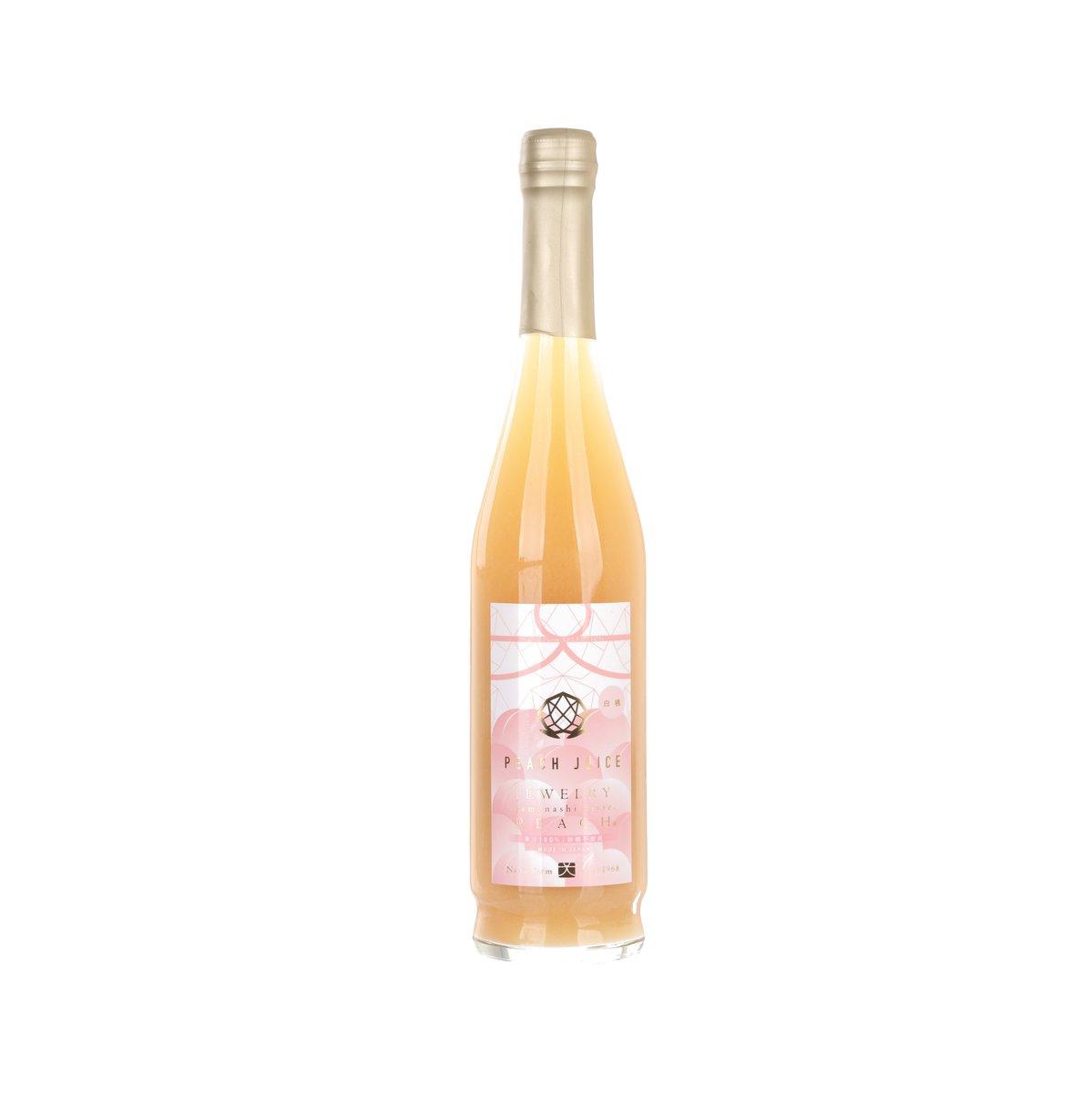 Peach nectar bottle with amber liquid and front label, capped neck
