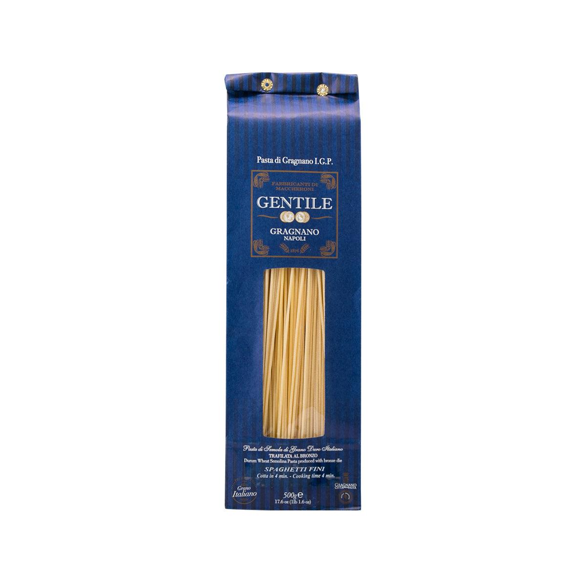 Artisanal spaghetti pasta package with bundled spaghetti strands in blue wrapper