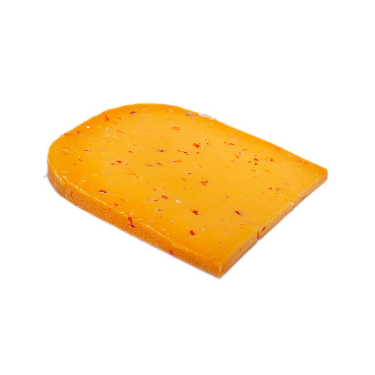 LANDANA chili sambal cheese wedge, orange with red chili specks