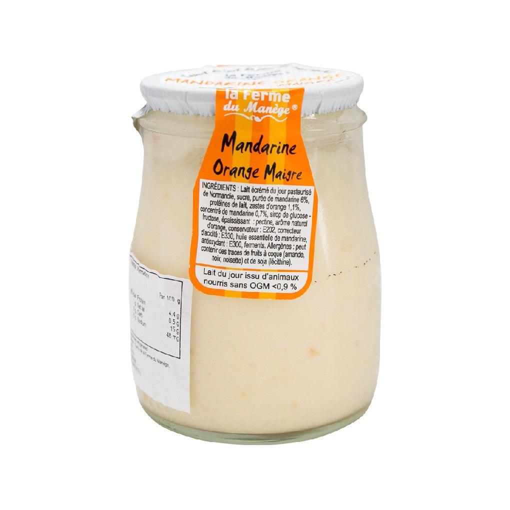 Low fat yogurt jar with mandarin orange label, creamy light yogurt inside.