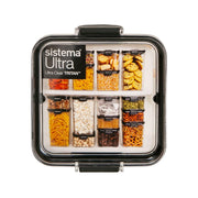 Square clear plastic food container with black lid, showing divided storage compartments
