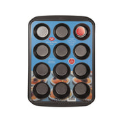 12-cup muffin pan with 12 round nonstick cavities and dark metal frame