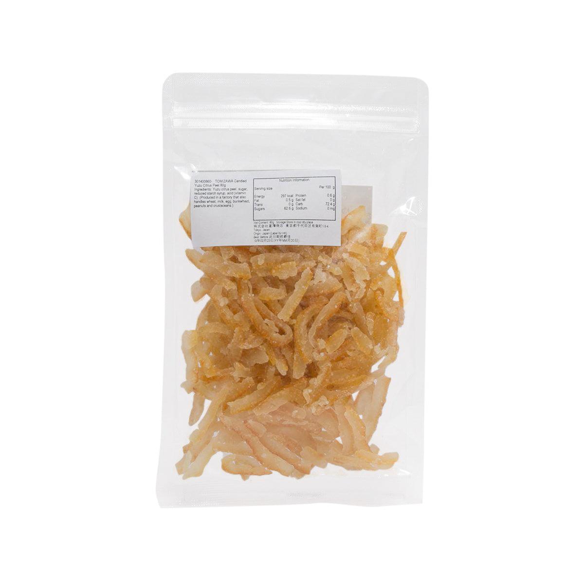 Candied yuzu peel in standing clear pouch, piled amber citrus strips and shavings