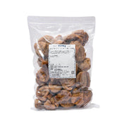 Dried Turkish figs in sealed plastic pouch, dark brown pieces.
